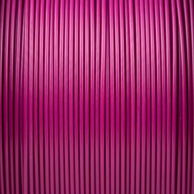 Magenta PLA filament strands